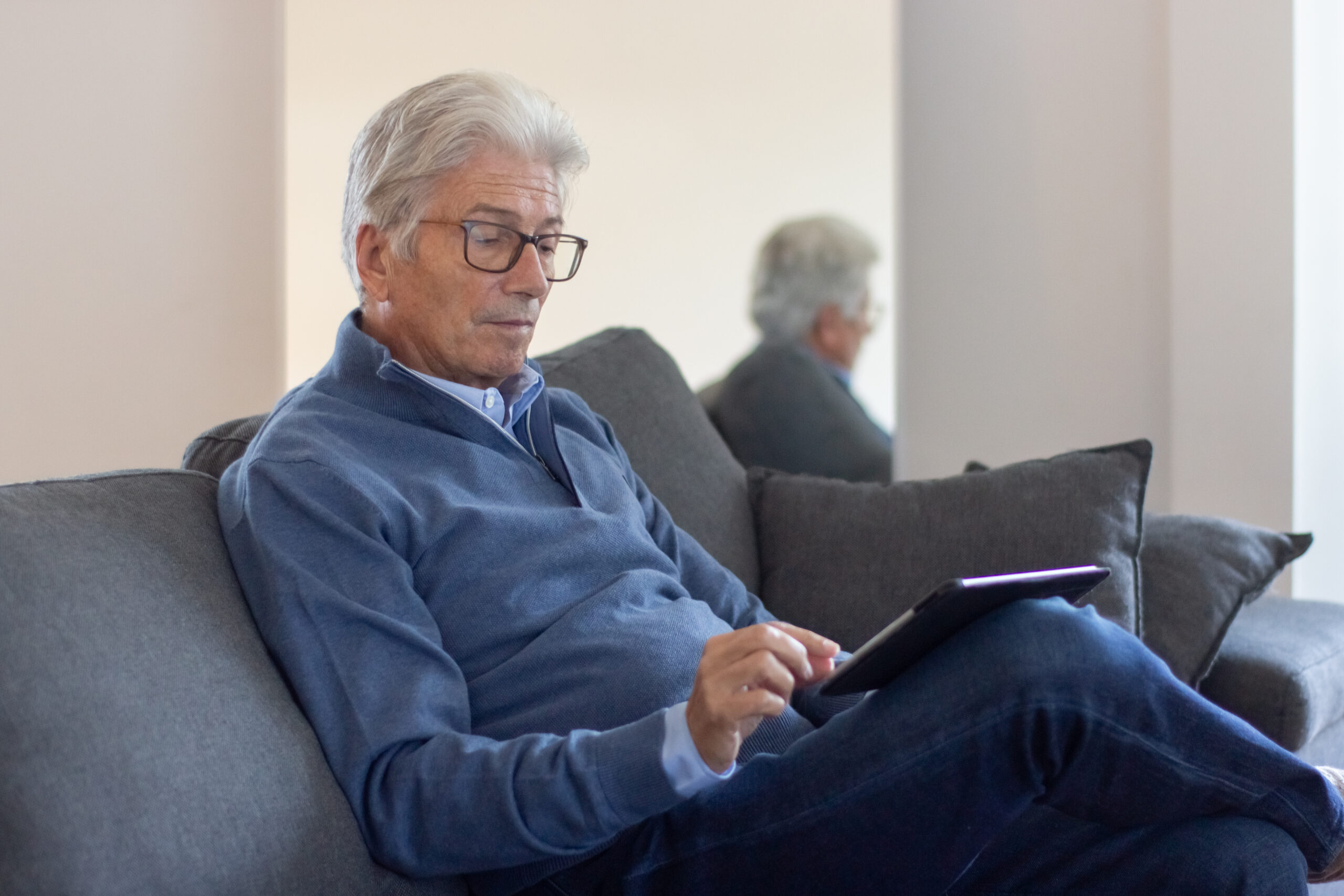 Senior patient using a tablet for a virtual medical consultation