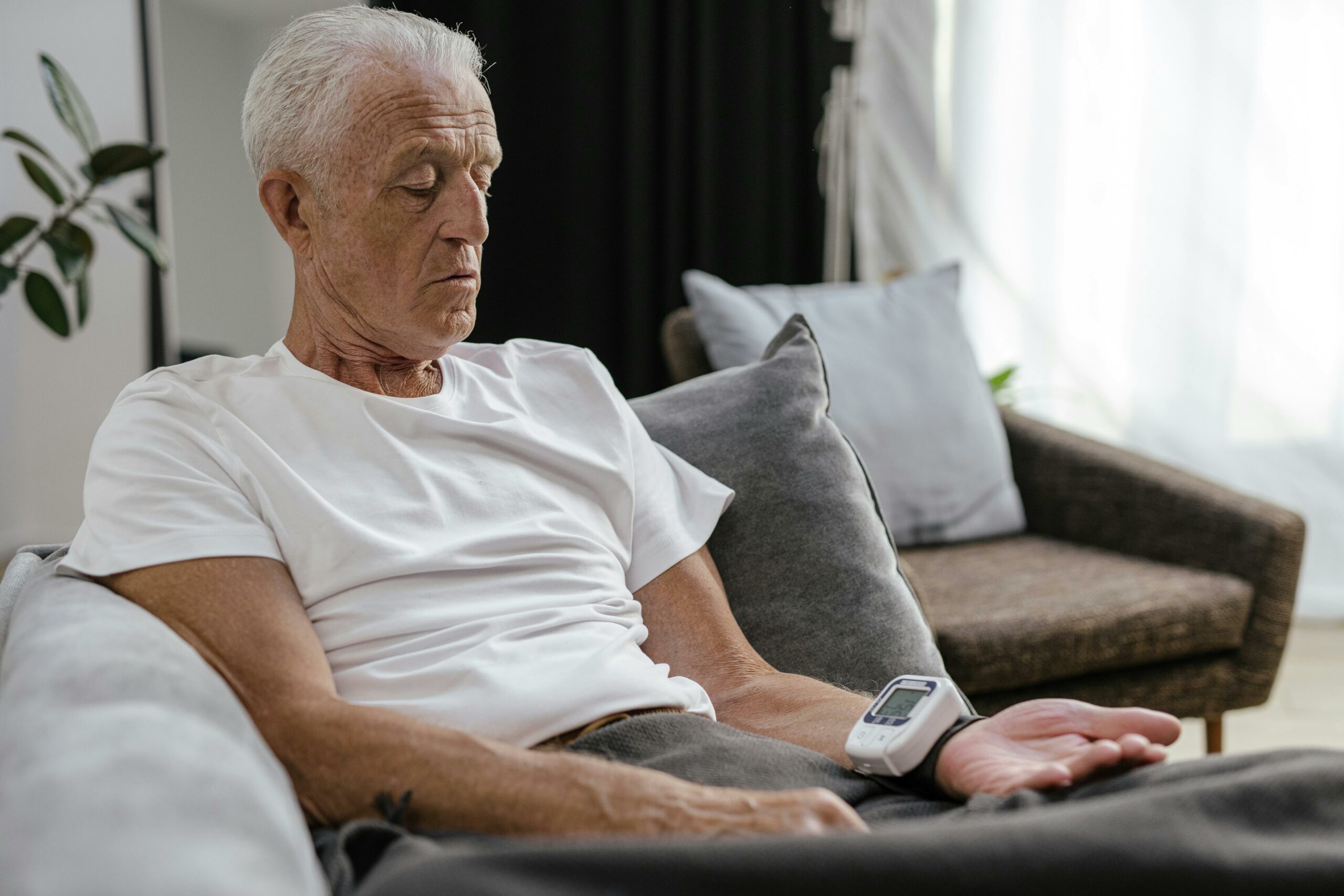 Elderly man checking vitals